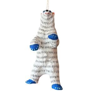 1. Hand-painted papier mâché polar bear ornament in black, white, and blue tones, suspended by a natural jute hanging string