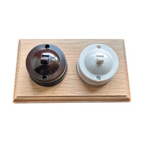 Brown and white two-way Bakelite dolly switch with vintage-style toggle – ideal for period property lighting