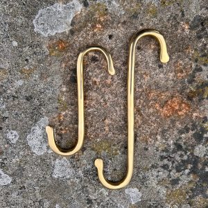 Solid brass S hooks in two sizes with flattened point, hand-polished with flattened ends—perfect for rustic kitchens or hanging plants and utensils