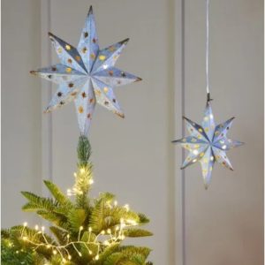 1. White distressed metal LED star by Lightstyle London illuminated with warm white lights, featuring a rustic pierced design