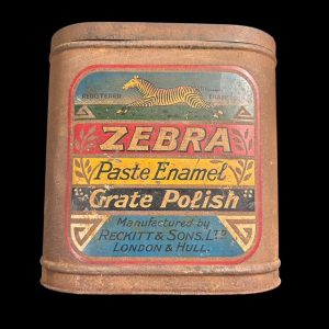 Vintage Zebra Paste Enamel Grate Polish tin with colourful leaping zebra label, rounded corners, and 18cm cubic size with aged patina.