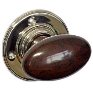 Mottled Brown smooth oval Bakelite door knobs on a polished nickel rose